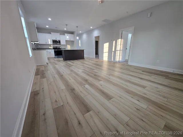 a view of kitchen and kitchen with sink