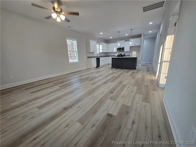a dining room with furniture and chandelier