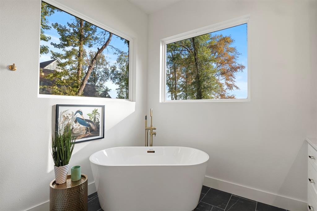 646 North Private Road Leesburg, TX 75451 - Photo 13 of 40 a white bath tub sitting next to a white sink