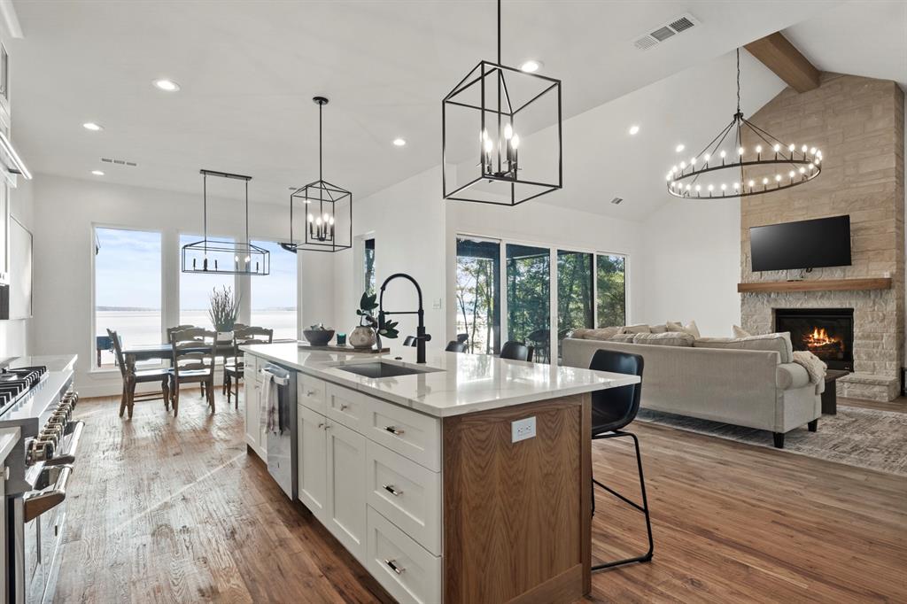 646 North Private Road Leesburg, TX 75451 - Photo 2 of 40 a kitchen with stainless steel appliances a stove center island a window and living room view