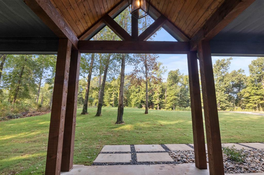 646 North Private Road Leesburg, TX 75451 - Photo 34 of 40 a view of a porch in front of a house with a big yard