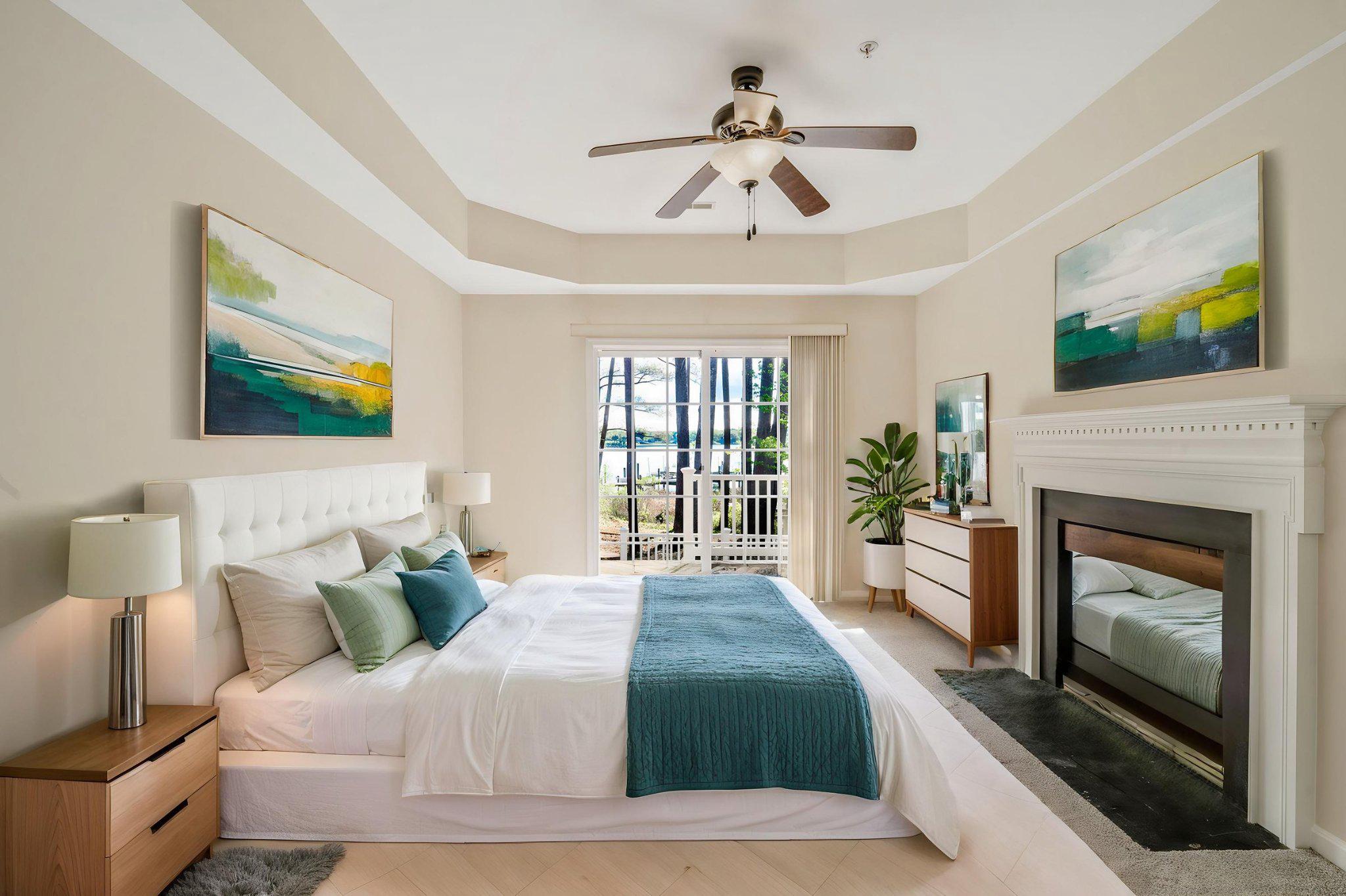 14240 Foxhall Road, Unit 15 Solomons, MD 20629 - Photo 2 of 7 a spacious bedroom with a large bed and a fireplace