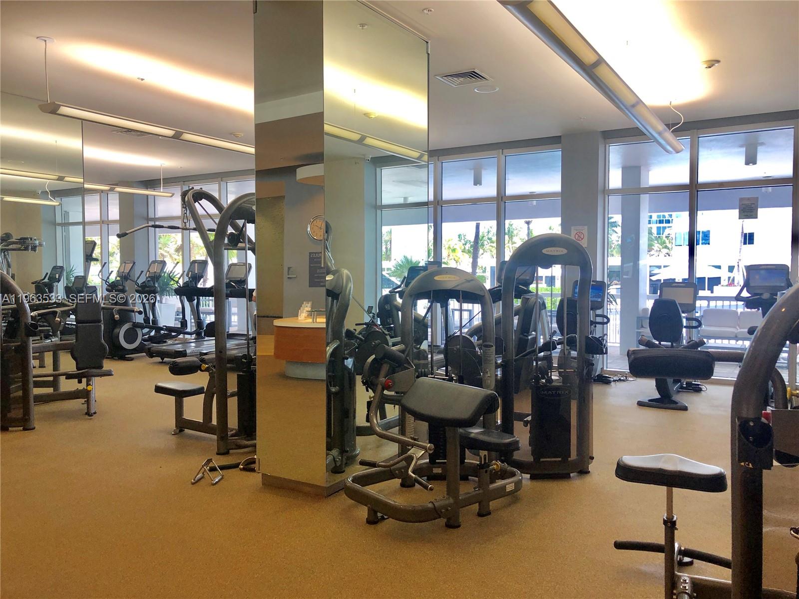 10275 Collins Avenue, Unit 427 Bal Harbour, FL 33154 - Photo 16 of 21 a view of a room with gym equipment