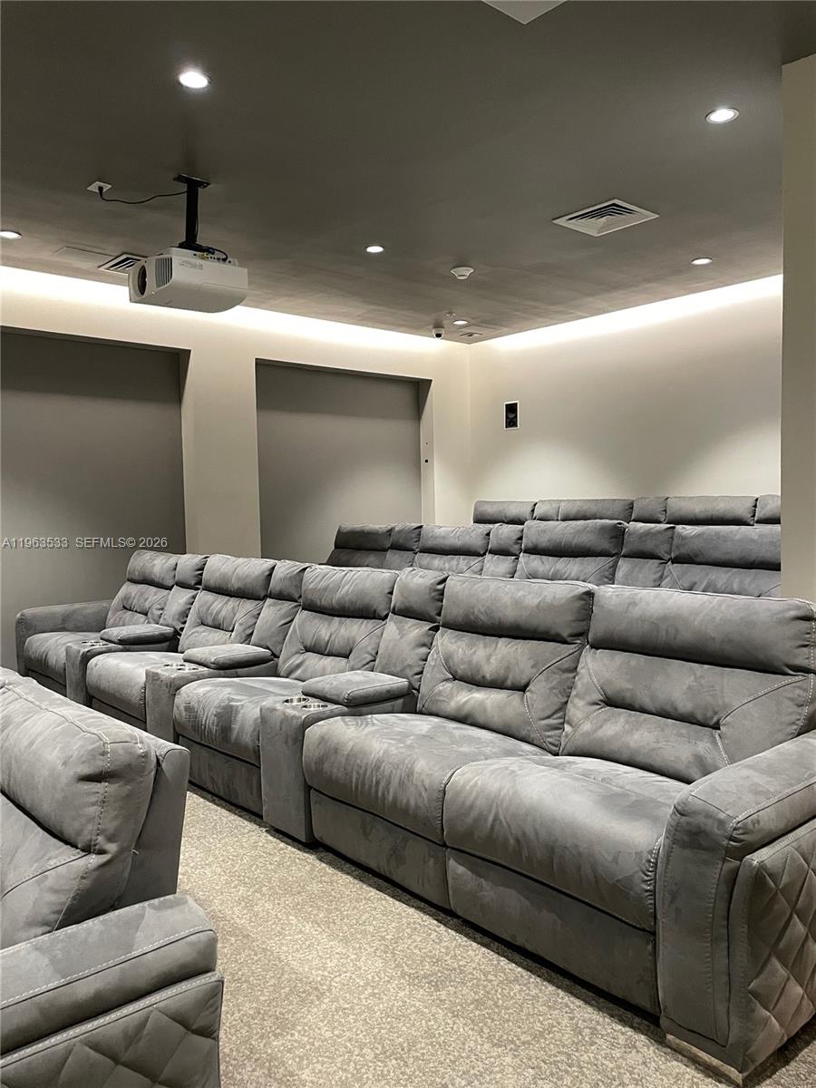 10275 Collins Avenue, Unit 427 Bal Harbour, FL 33154 - Photo 18 of 21 a living room with furniture and a flat screen tv