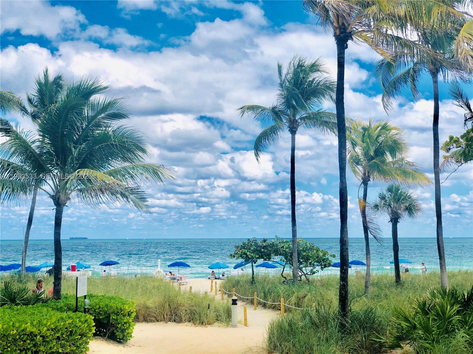 10275 Collins Avenue, Unit 427 Bal Harbour, FL 33154 - Photo 20 of 21 a view of a yard and palm trees