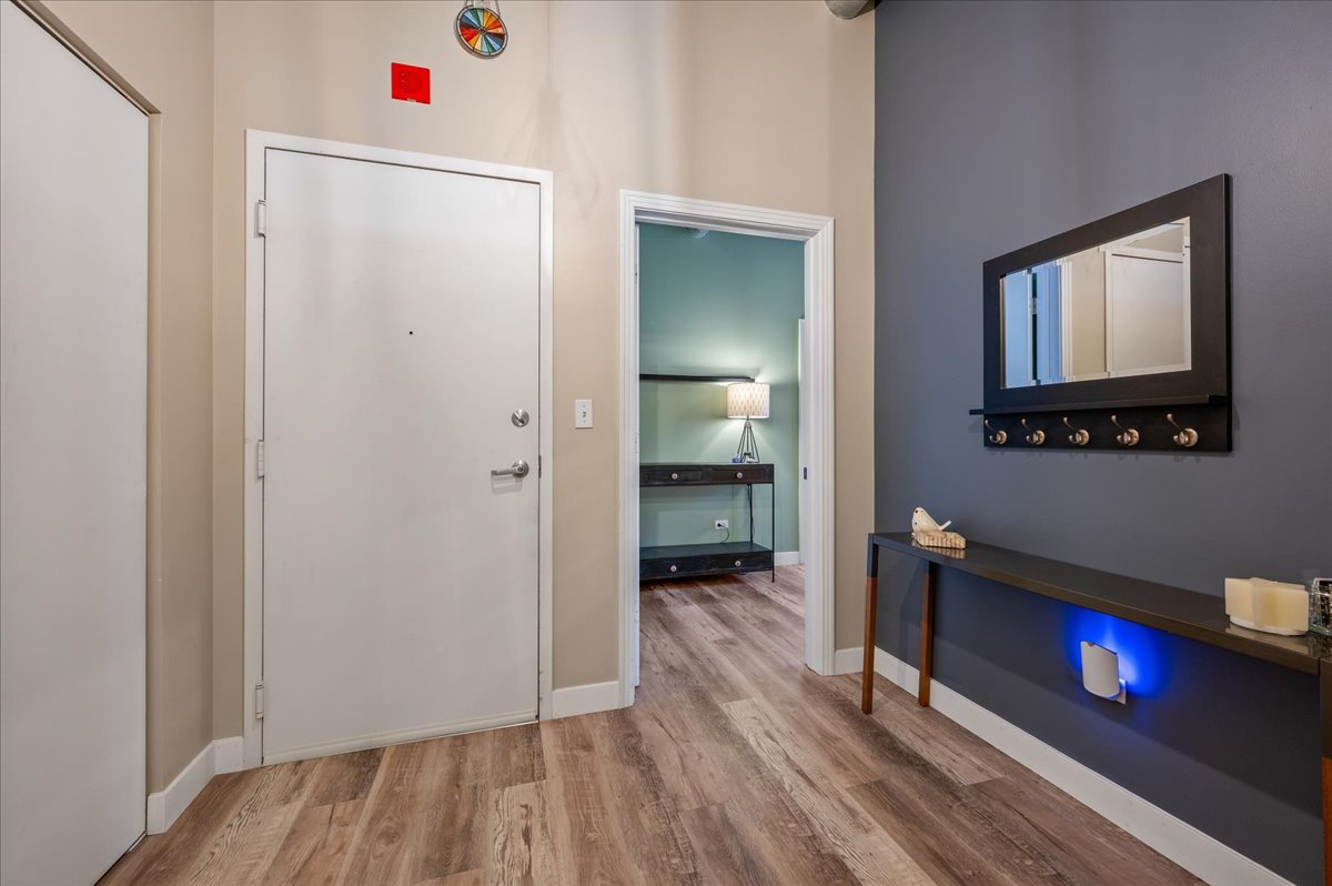 811 West 15th Place, Unit 708 Chicago, IL 60608 - Photo 11 of 26 a view of a room with wooden floor and a bathroom