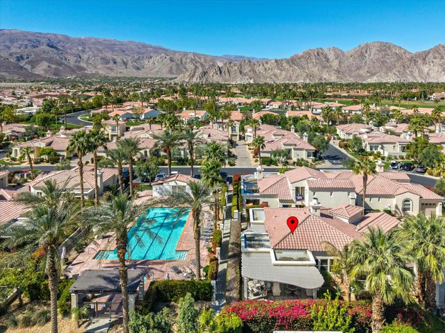 an aerial view of residential houses and outdoor space