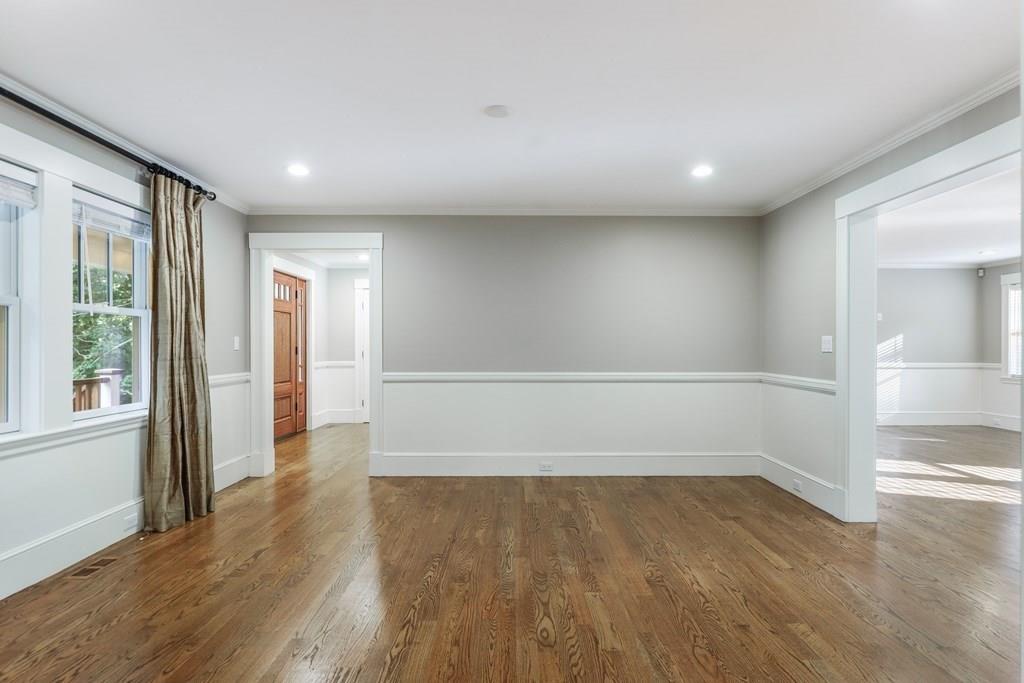 28 Fells Road Winchester, MA 01890 - Photo 14 of 42 wooden floor in an empty room with a window