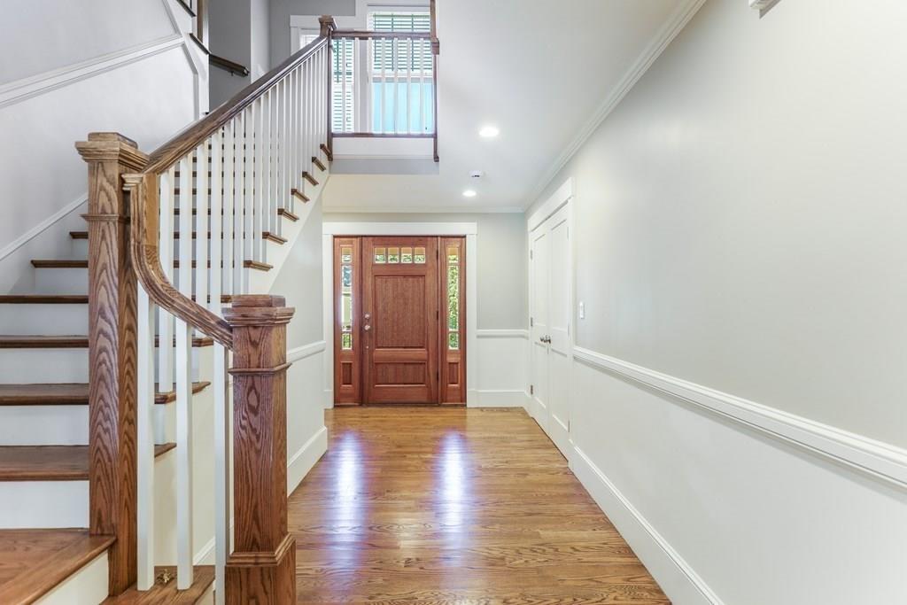 28 Fells Road Winchester, MA 01890 - Photo 20 of 42 a view of entryway with wooden floor and stairs