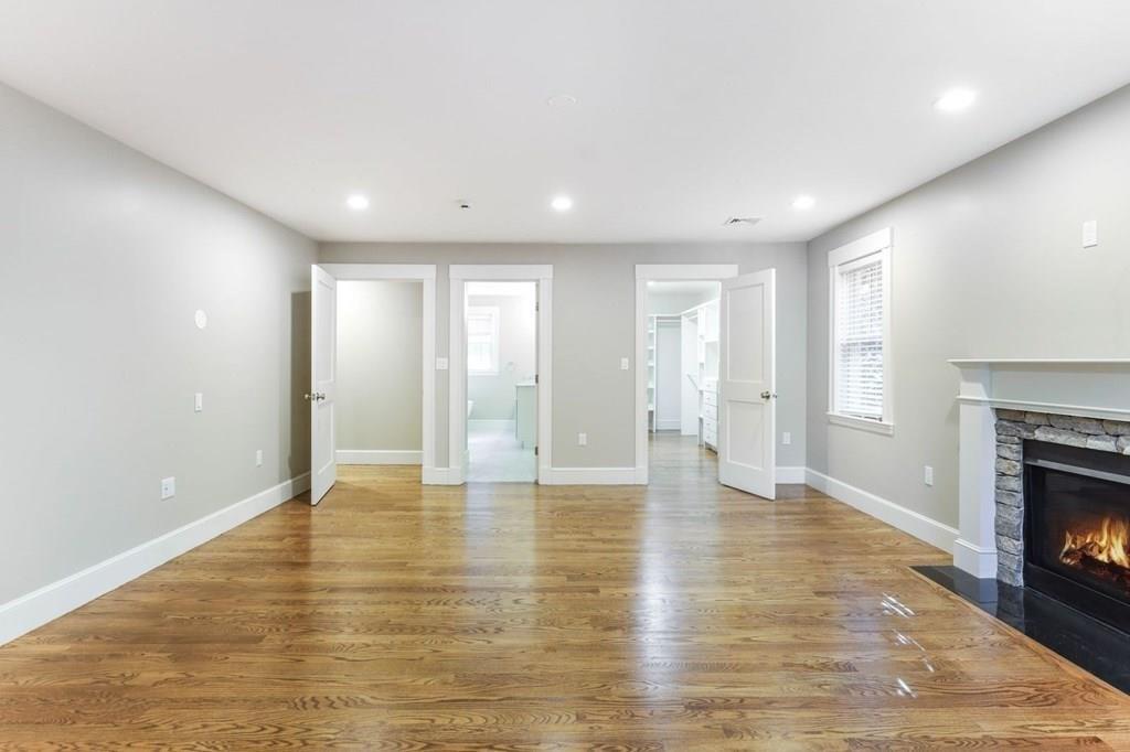 28 Fells Road Winchester, MA 01890 - Photo 22 of 42 a view of an empty room with window and fire place