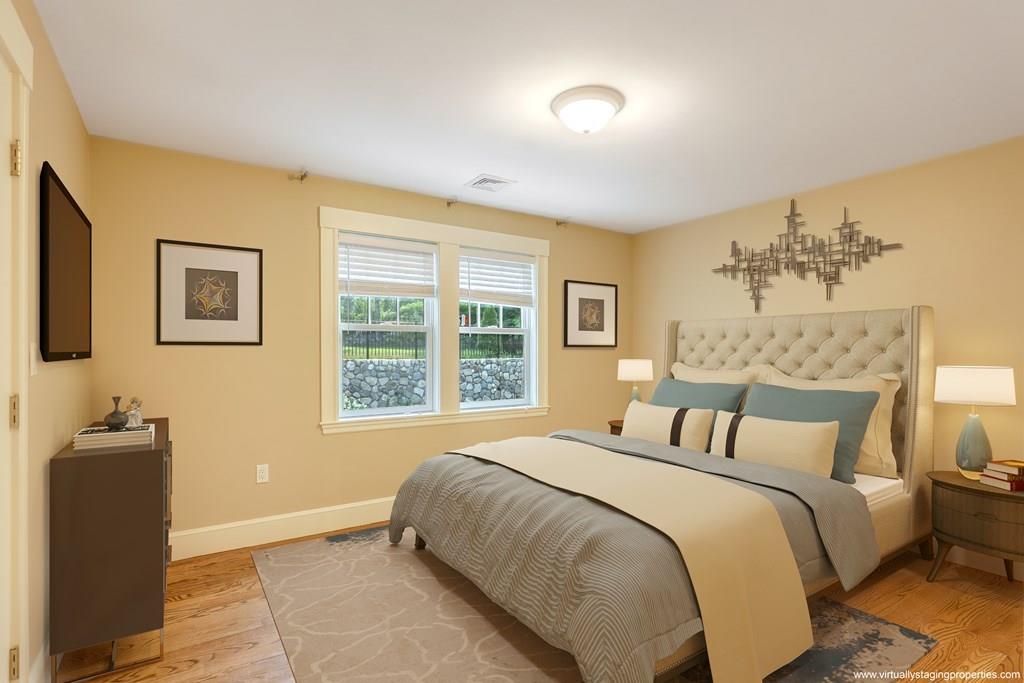 28 Fells Road Winchester, MA 01890 - Photo 24 of 42 a bedroom with a bed and a couch