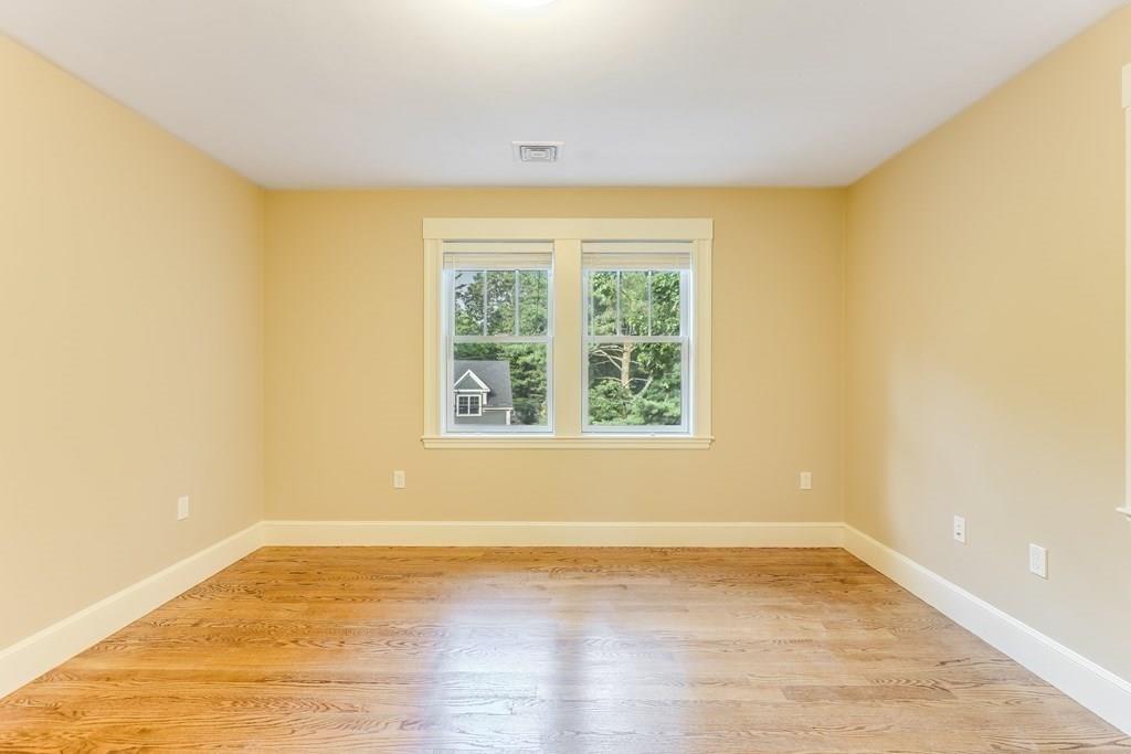 28 Fells Road Winchester, MA 01890 - Photo 25 of 42 a view of empty room with wooden floor and fan