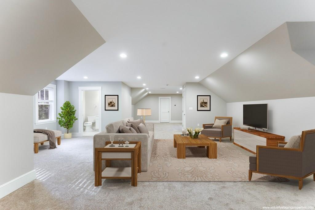 28 Fells Road Winchester, MA 01890 - Photo 30 of 42 a living room with furniture and a flat screen tv