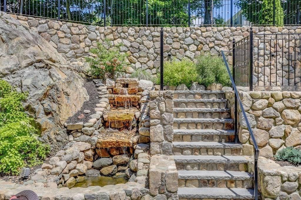 28 Fells Road Winchester, MA 01890 - Photo 38 of 42 a view of a buildings with a yard