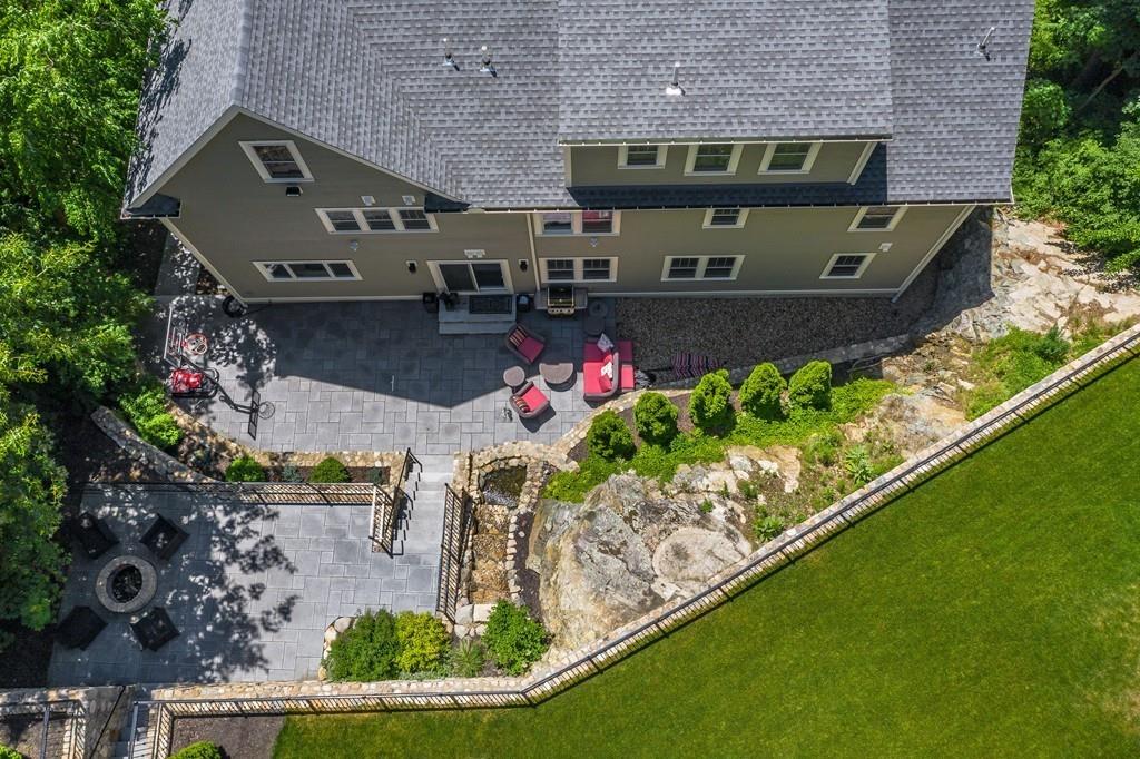 28 Fells Road Winchester, MA 01890 - Photo 4 of 42 an aerial view of a house with a garden and lake