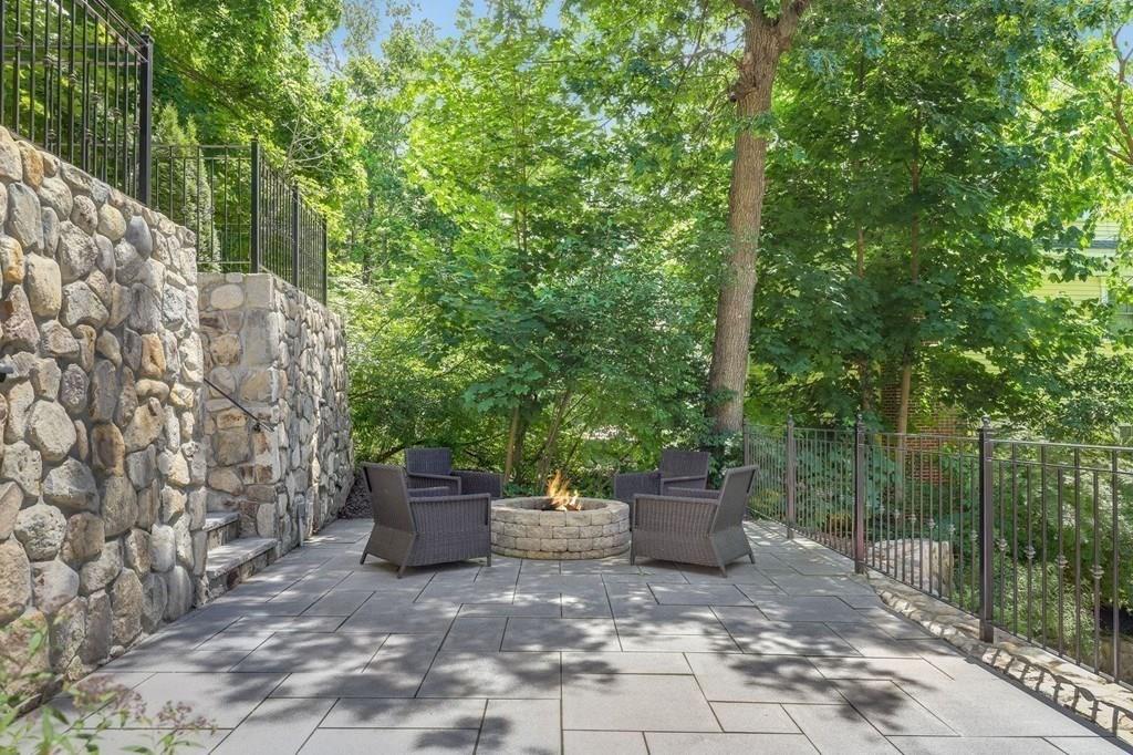 28 Fells Road Winchester, MA 01890 - Photo 41 of 42 a view of a chair and table in the backyard
