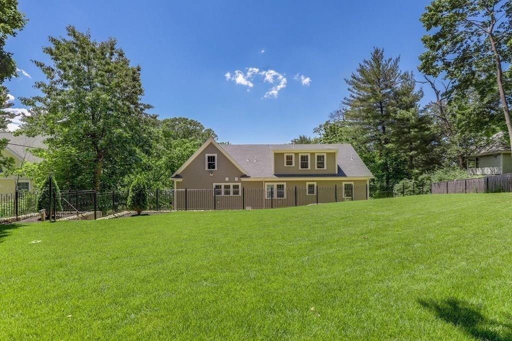 28 Fells Road Winchester, MA 01890 - Photo 42 of 42 a front view of a house with yard and green space