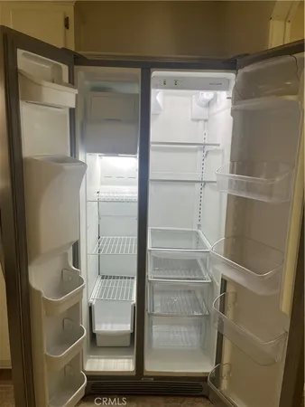 a view of a kitchen with a refrigerator