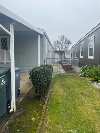 a view of house with backyard