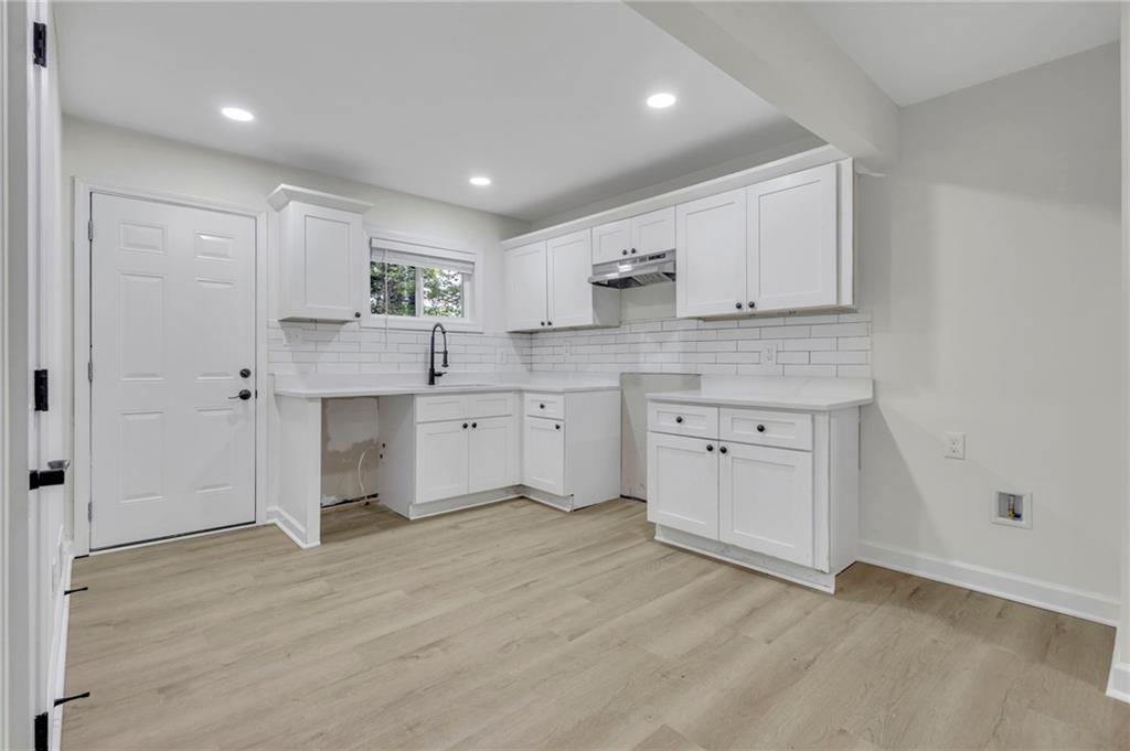 3531 Tulip Drive Decatur, GA 30032 - Photo 19 of 48 a kitchen with a sink cabinets and wooden floor