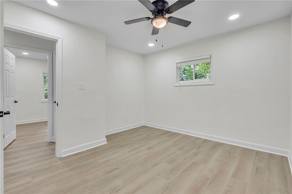3531 Tulip Drive Decatur, GA 30032 - Photo 21 of 48 an empty room with wooden floor and windows