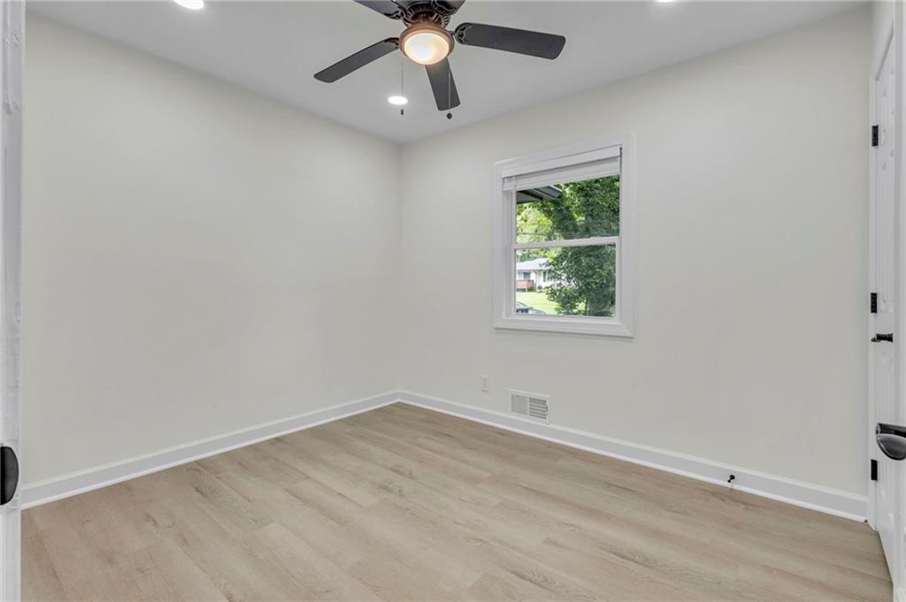 3531 Tulip Drive Decatur, GA 30032 - Photo 31 of 48 an empty room with a window and a fan