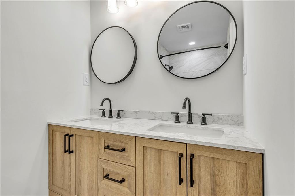 3531 Tulip Drive Decatur, GA 30032 - Photo 34 of 48 a bathroom with a granite countertop double vanity sink and a mirror