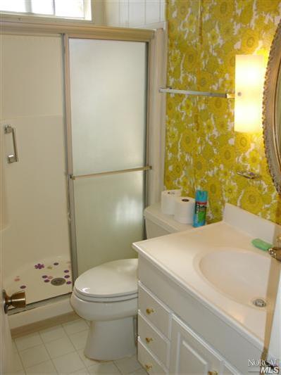 25 Shadybrook Court Santa Rosa, CA 95409 - Photo 8 of 11 a bathroom with a sink a toilet and shower