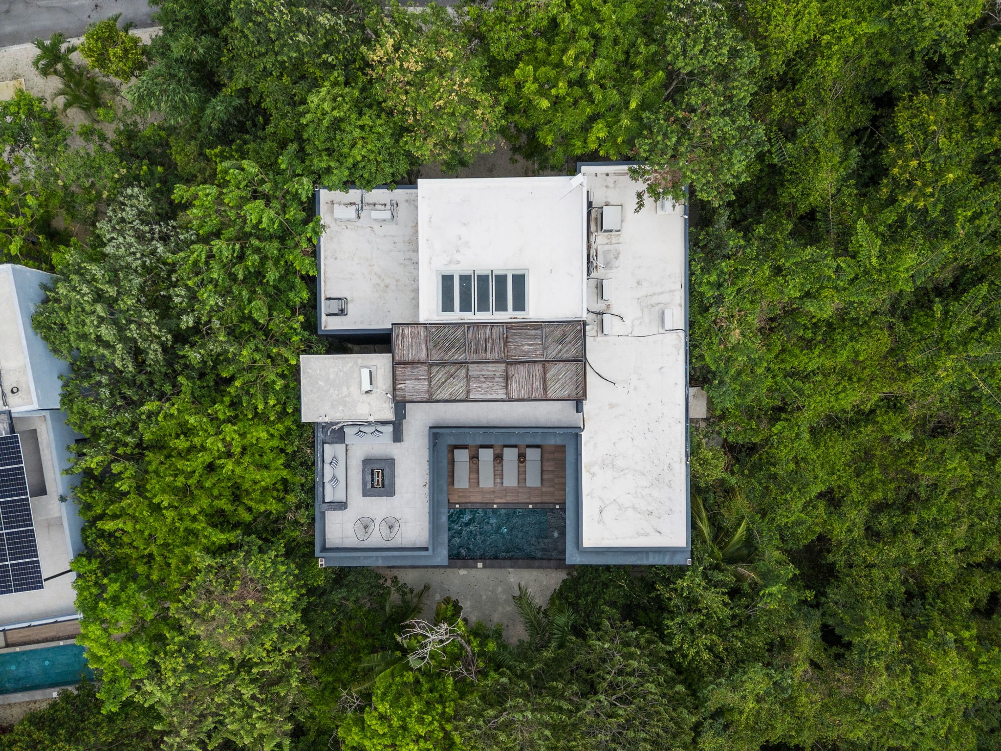 6 Country Club, Unit 4 Nome, TX 77629 - Photo 40 of 45 A top-down aerial perspective reveals the brilliant architectural geometry of this private villa, completely enclosed by a dense buffer of lush tropical jungle.