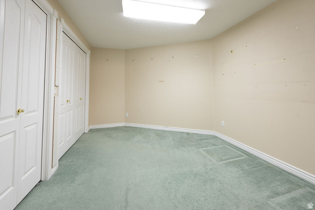 875 East 1300th Street North Mapleton, UT 84664 - Photo 47 of 65 Unfurnished bedroom with light carpet and two closets