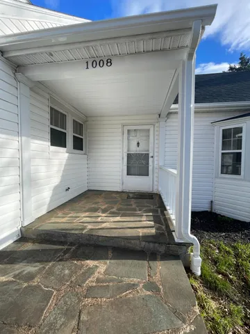 a view of a porch of a house
