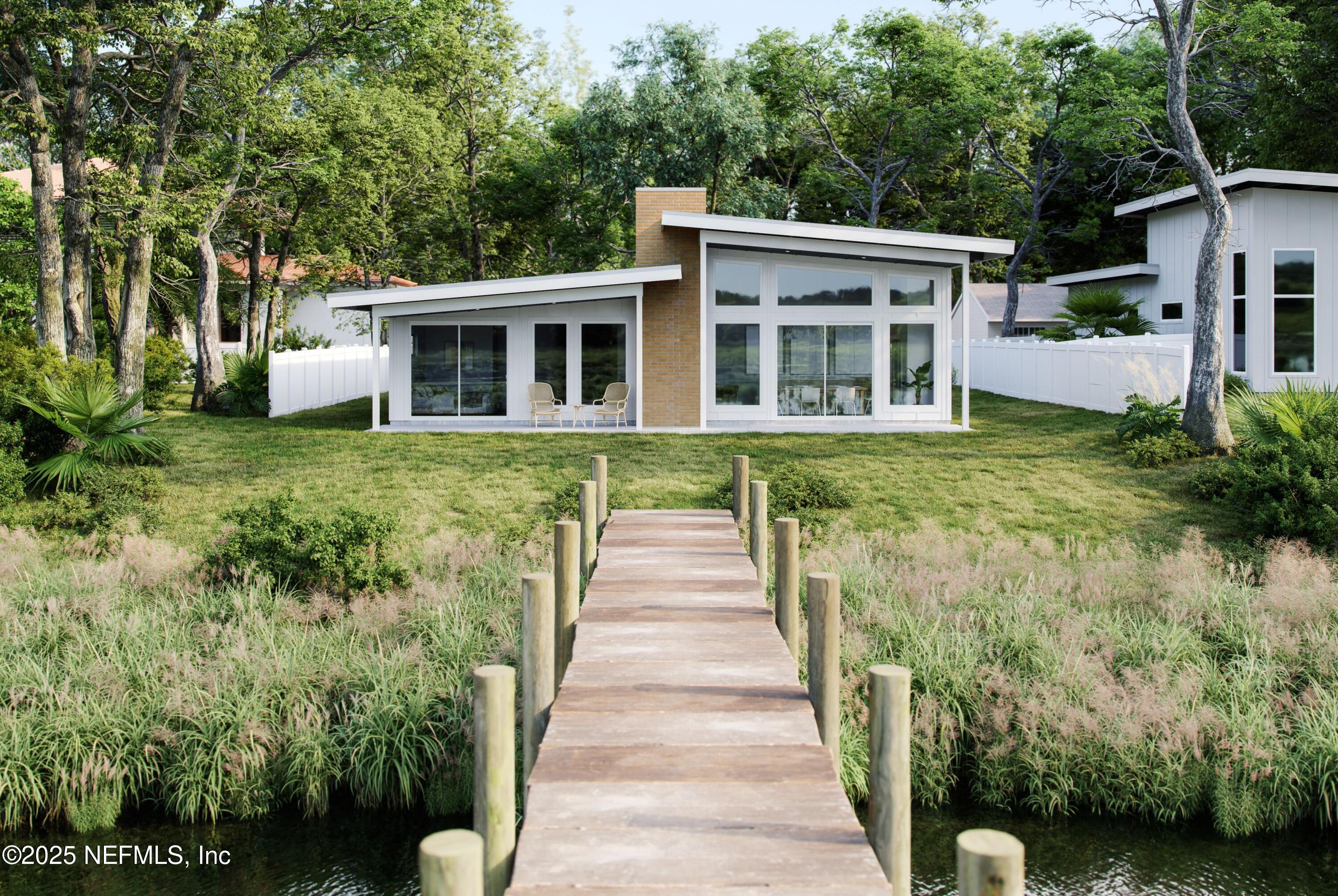 22 Poinciana Cove Road St. Augustine, FL 32084 - Photo 11 of 20 a front view of a house with a garden