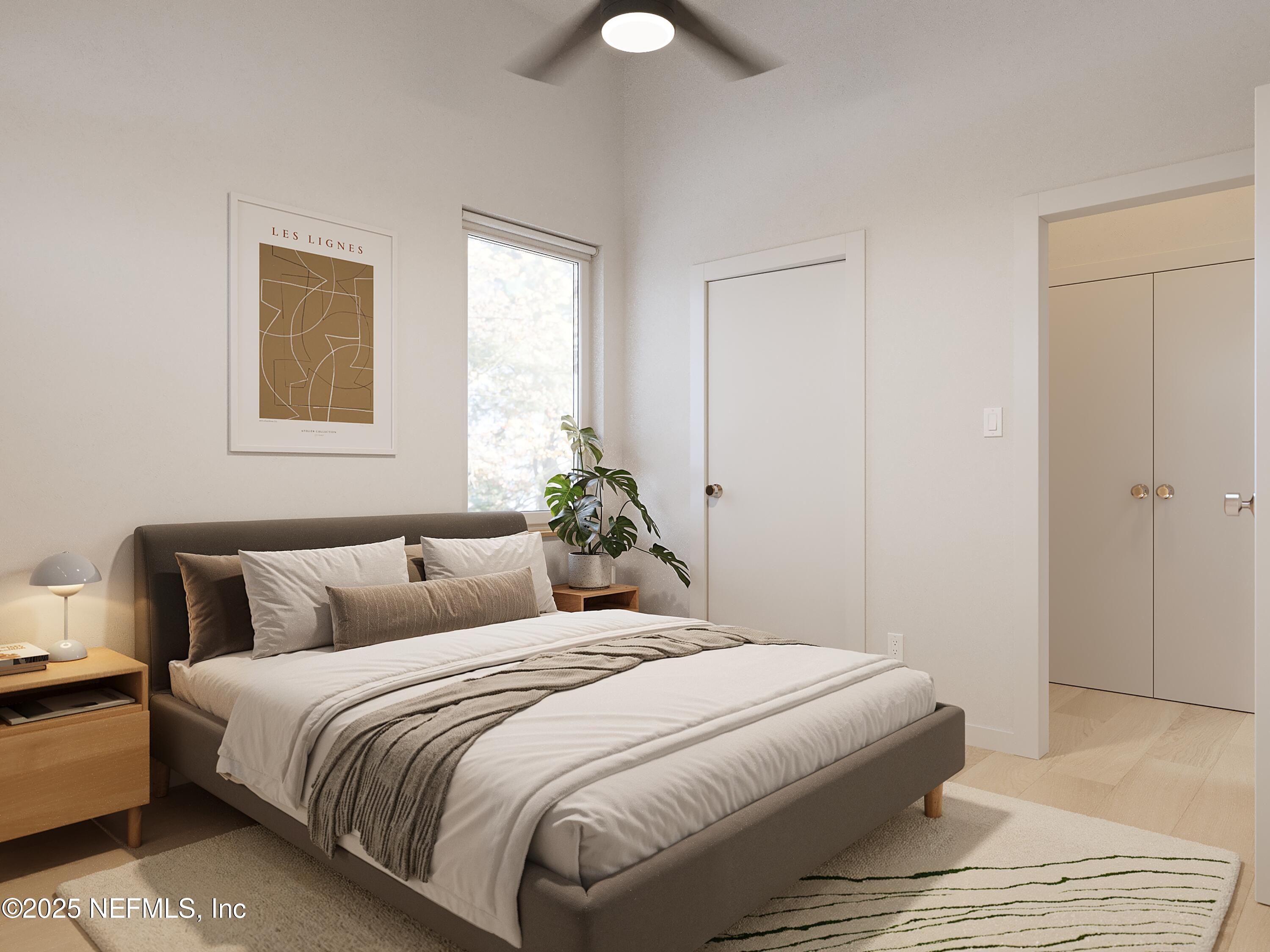 22 Poinciana Cove Road St. Augustine, FL 32084 - Photo 9 of 20 a bedroom with a bed and a lamp