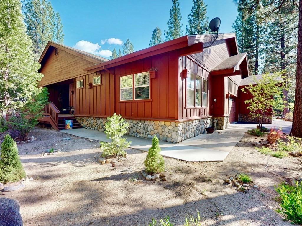 27 One Horse Way Clio, CA 96106 - Photo 1 of 38 a front view of a house with garden