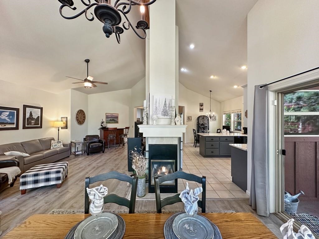 27 One Horse Way Clio, CA 96106 - Photo 15 of 38 a living room with furniture kitchen view and a fireplace