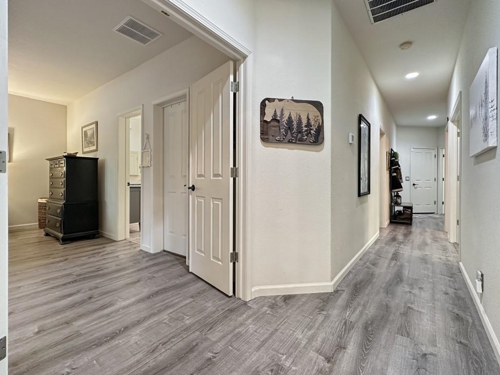 27 One Horse Way Clio, CA 96106 - Photo 16 of 38 a view of a hallway with wooden floor and closet