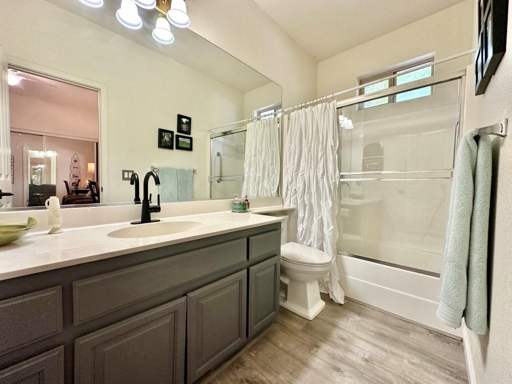 27 One Horse Way Clio, CA 96106 - Photo 23 of 38 a bathroom with a double vanity sink mirror and toilet