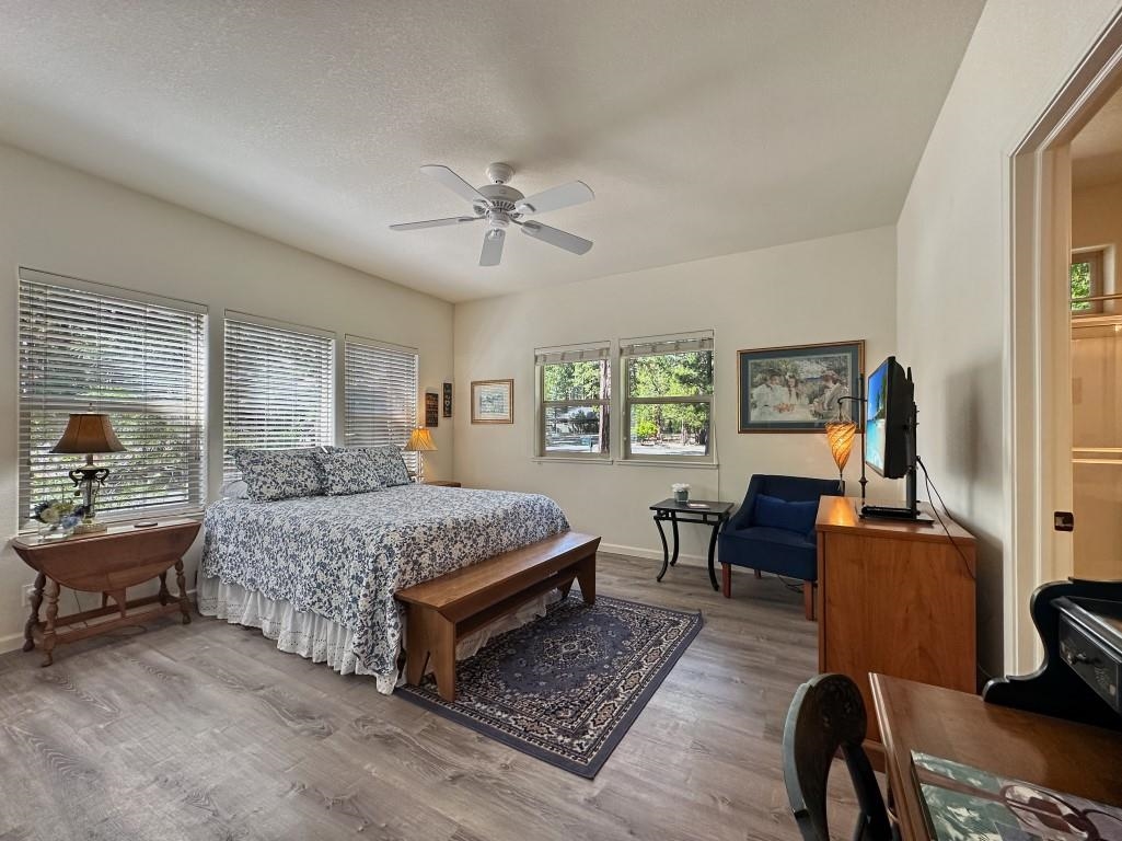 27 One Horse Way Clio, CA 96106 - Photo 24 of 38 a bedroom with a bed a couch and a window