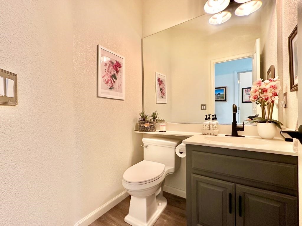 27 One Horse Way Clio, CA 96106 - Photo 28 of 38 a bathroom with a toilet a sink and mirror