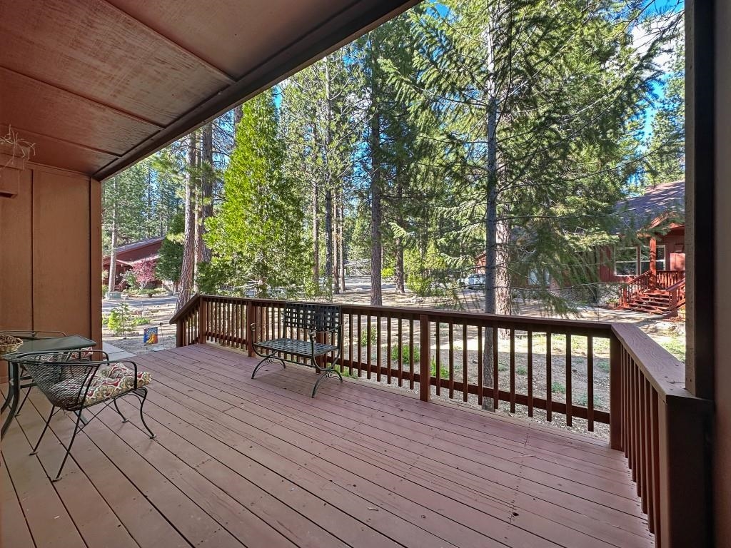 27 One Horse Way Clio, CA 96106 - Photo 5 of 38 a view of balcony with wooden floor and outdoor seating