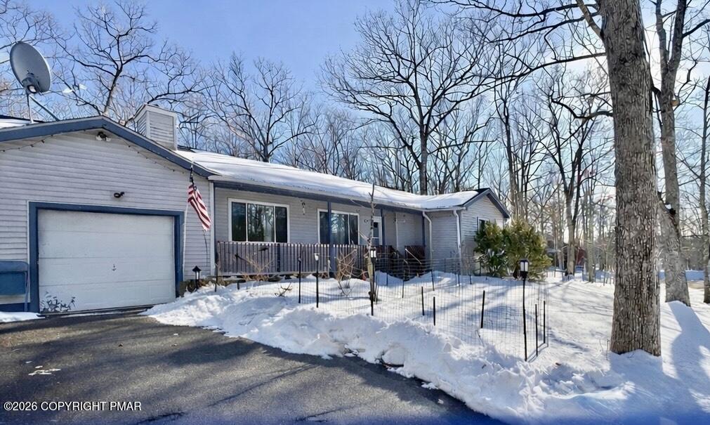217 Bindale Road Tamiment, PA 18371 - Photo 1 of 27 a front view of a house with a yard