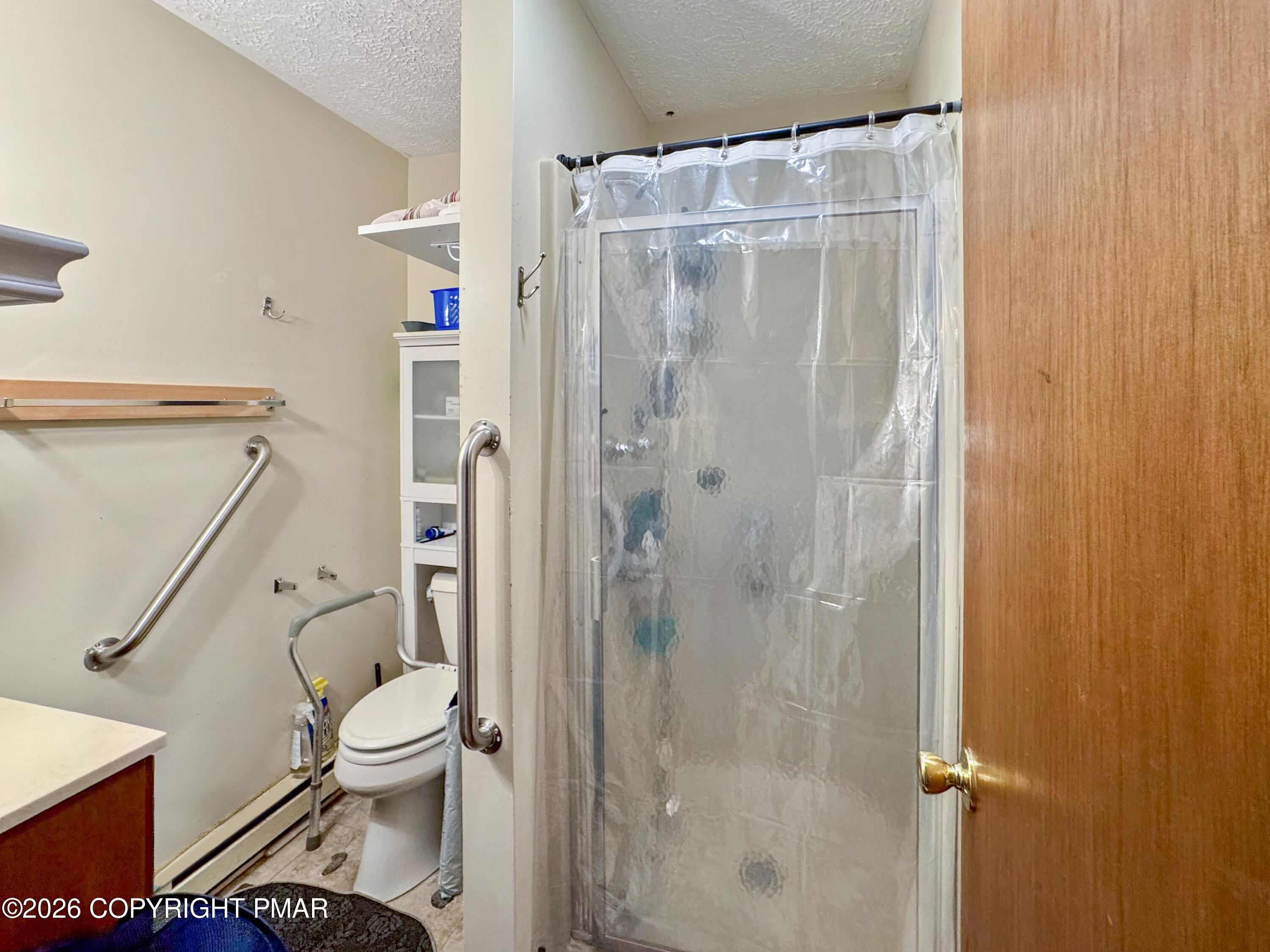 217 Bindale Road Tamiment, PA 18371 - Photo 11 of 27 a bathroom with a shower a toilet and a sink