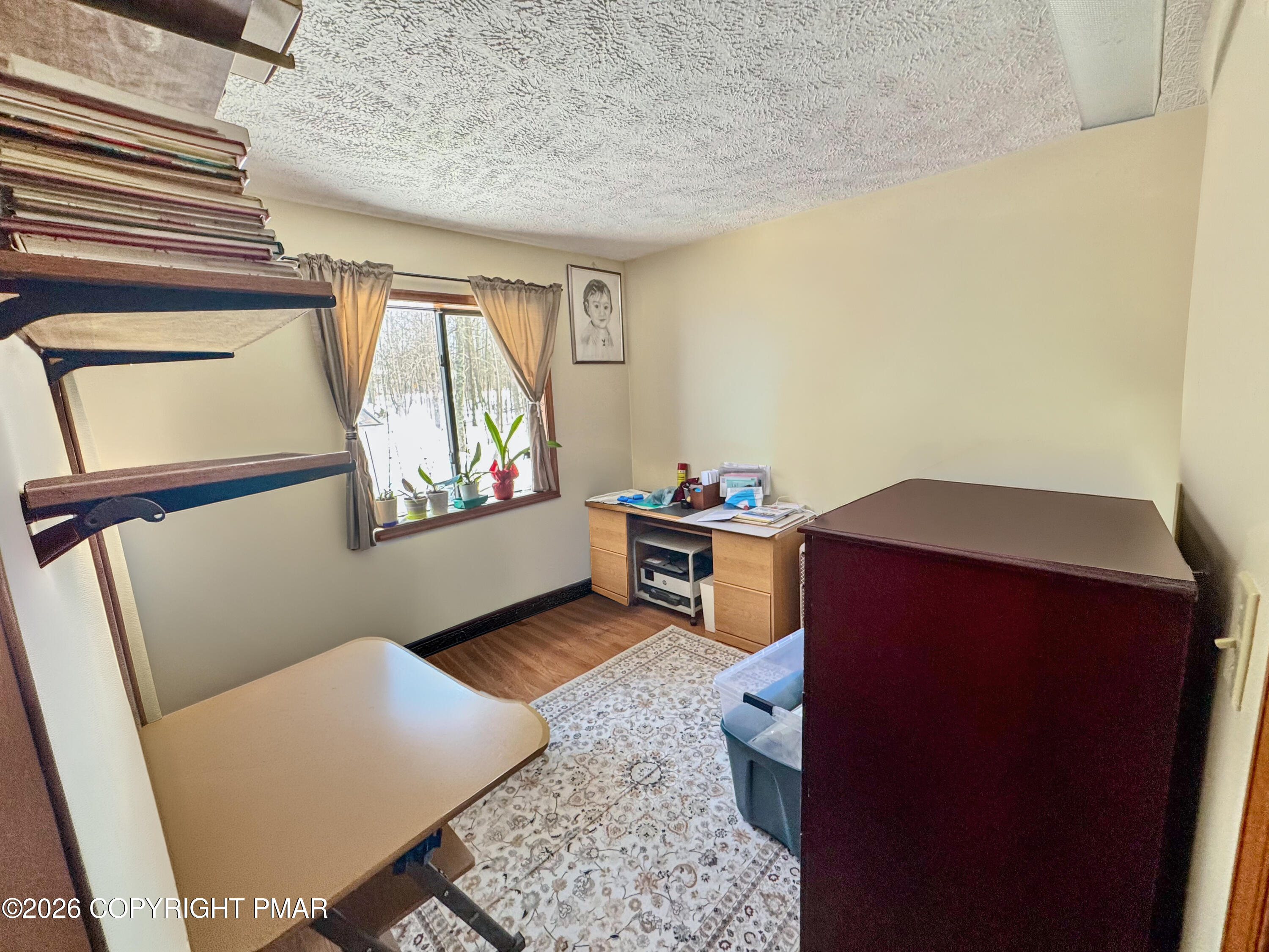 217 Bindale Road Tamiment, PA 18371 - Photo 14 of 27 a living room with a couch and a dresser with wooden floor