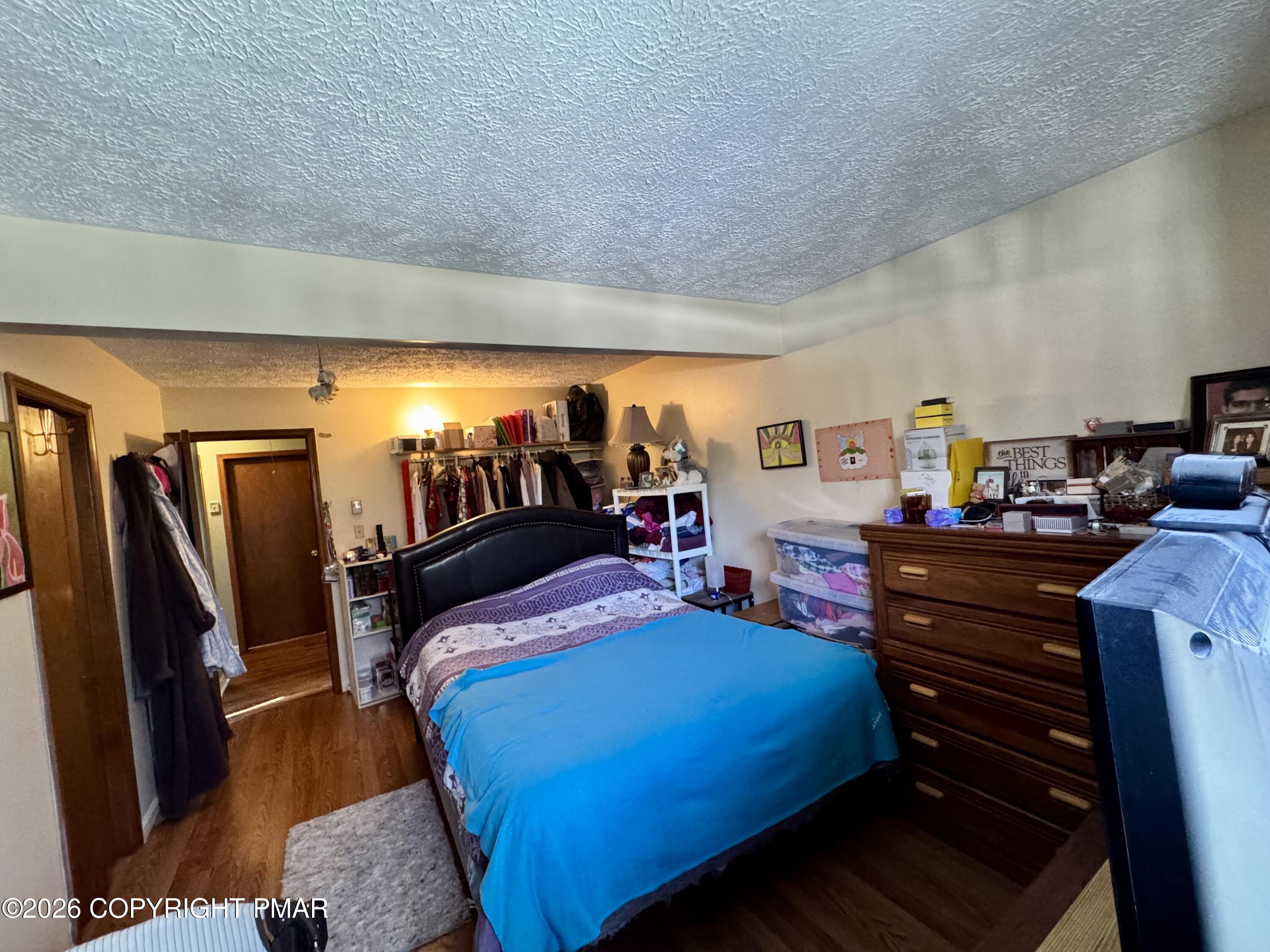 217 Bindale Road Tamiment, PA 18371 - Photo 16 of 27 a bedroom with a bed and dresser