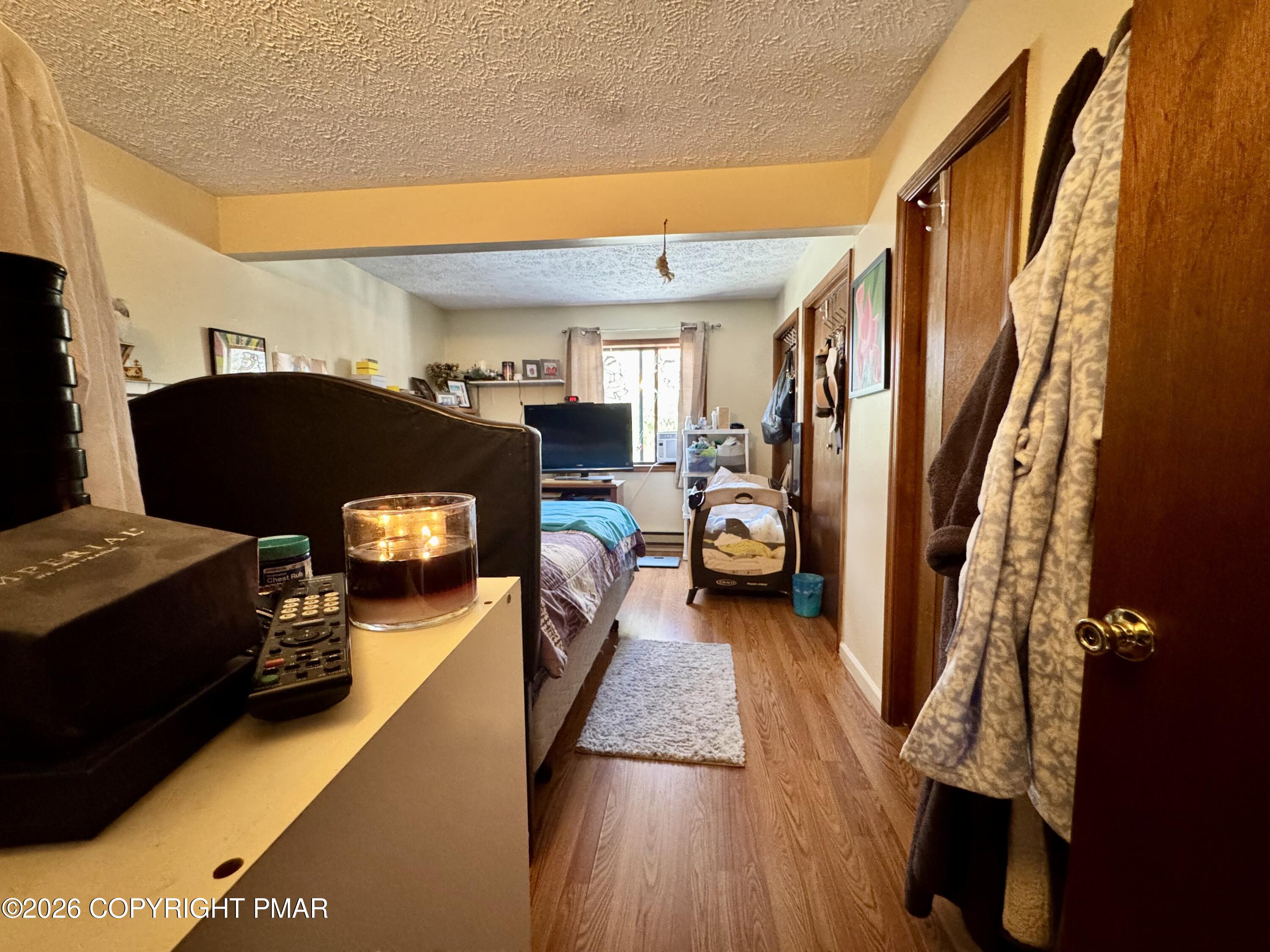217 Bindale Road Tamiment, PA 18371 - Photo 17 of 27 a living room with furniture and a fireplace
