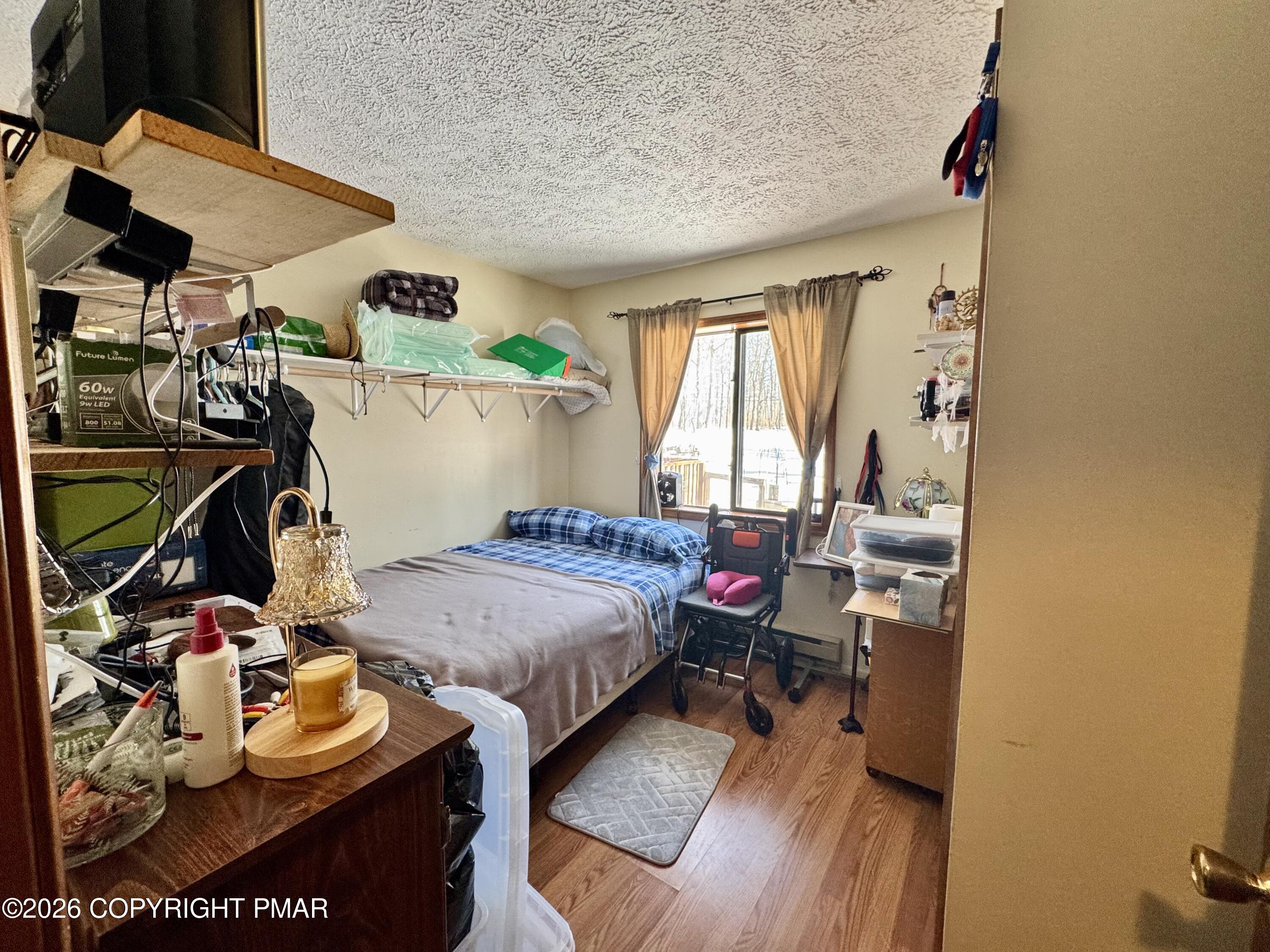 217 Bindale Road Tamiment, PA 18371 - Photo 19 of 27 a bedroom with bed and a window