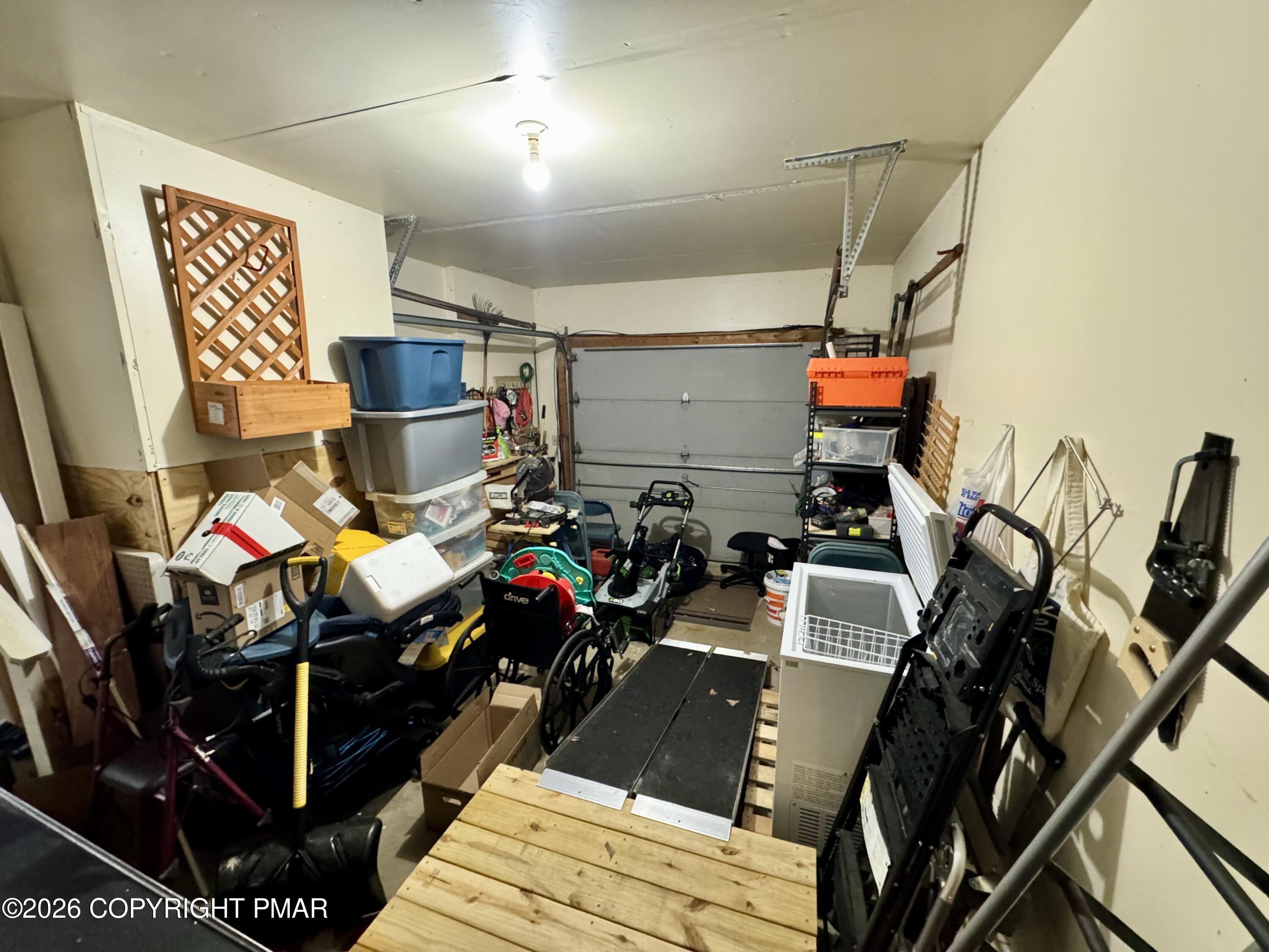 217 Bindale Road Tamiment, PA 18371 - Photo 21 of 27 a room with gym equipment and a view of living room