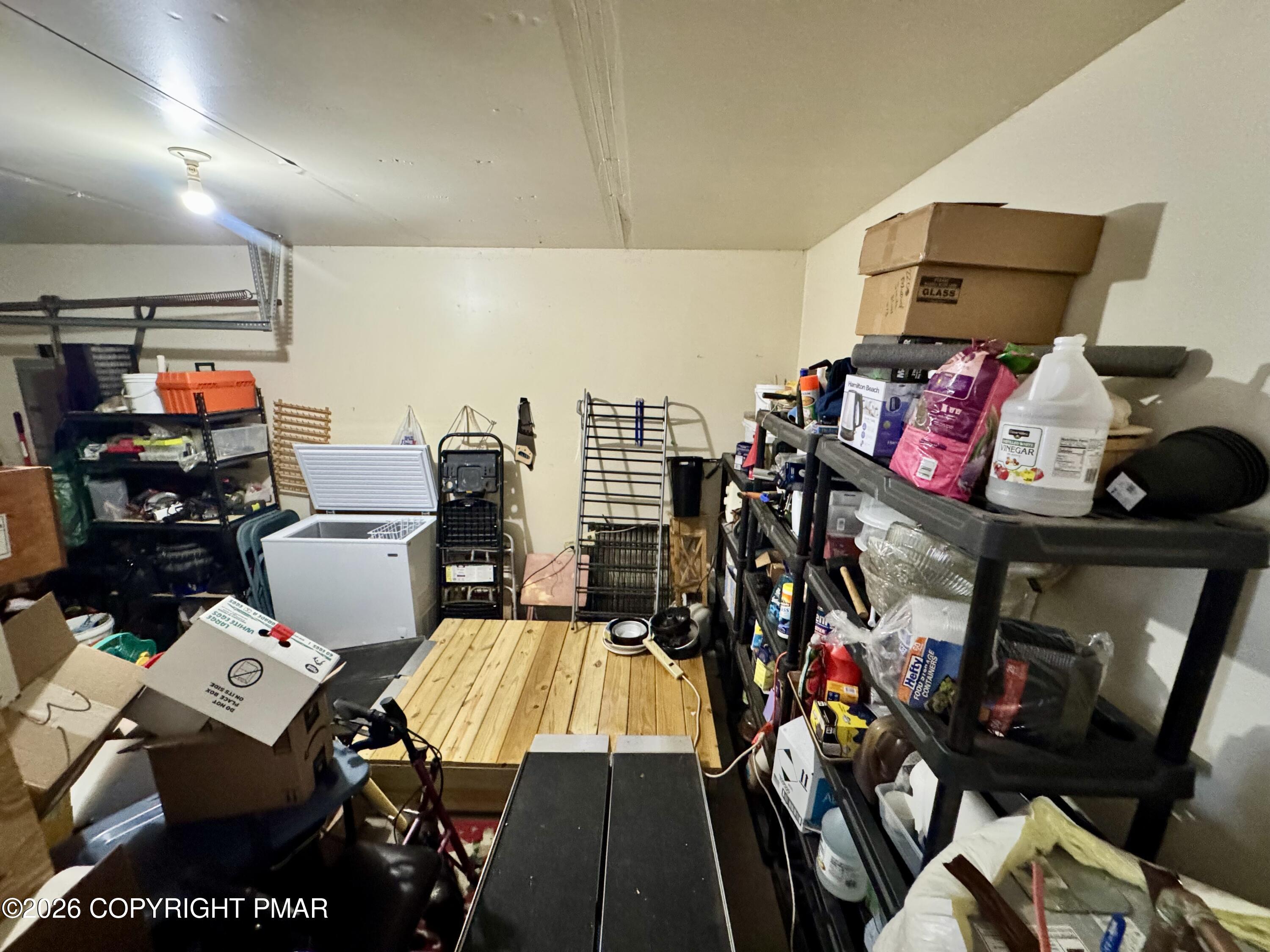 217 Bindale Road Tamiment, PA 18371 - Photo 22 of 27 a living room with lots of stuff and furniture