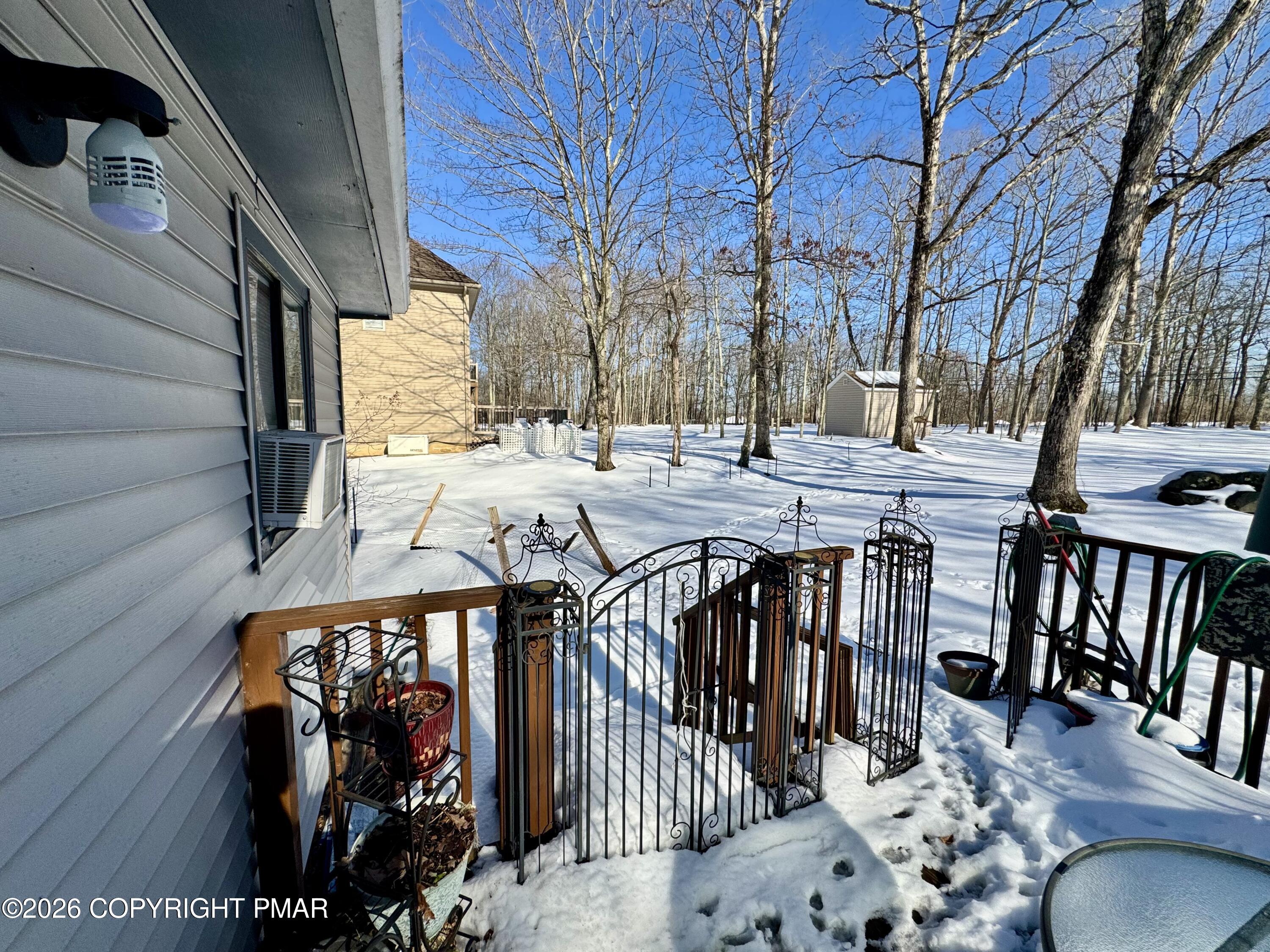 217 Bindale Road Tamiment, PA 18371 - Photo 24 of 27 a view of a patio with a table and chairs