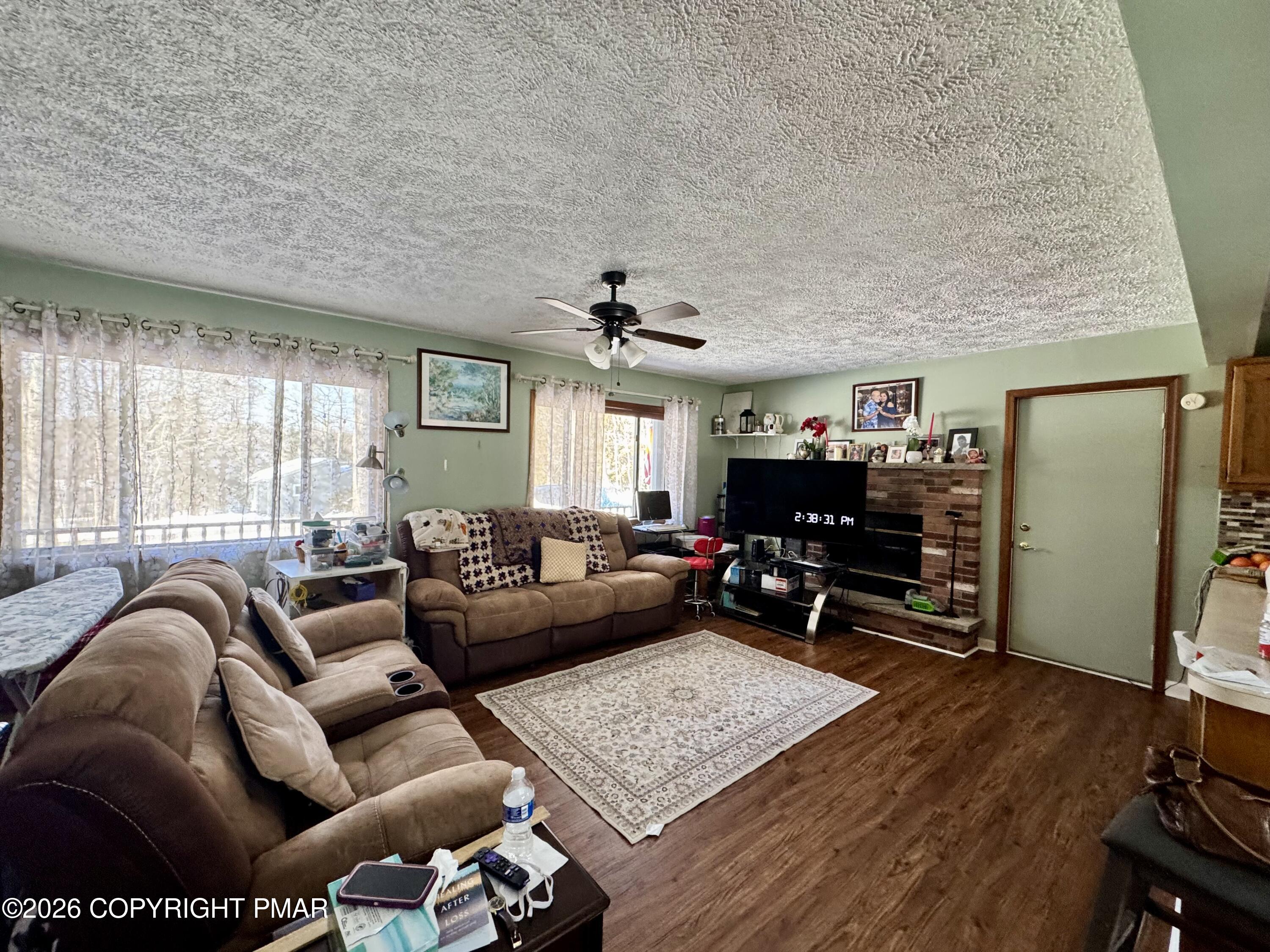 217 Bindale Road Tamiment, PA 18371 - Photo 3 of 27 a living room with furniture and a wooden floor